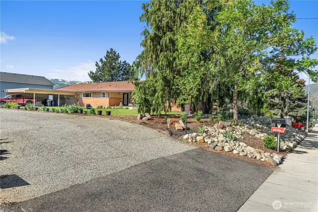 Eastern level yard space, garden beds on South of the home for perfect growing