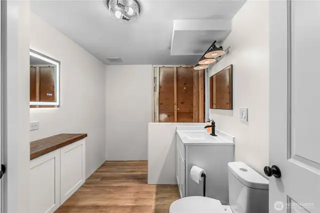 Renovated bathroom on lower level. Shower to be completed shortly