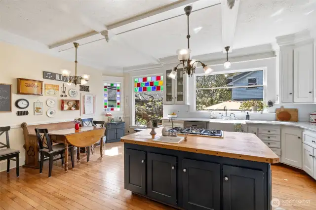 You will LOVE this kitchen! The floor was reclaimed from the old Snohomish High School gym. The kitchen and family room windows came from two old Snohomish houses that were torn down. The gorgeous window over the sink is original.
