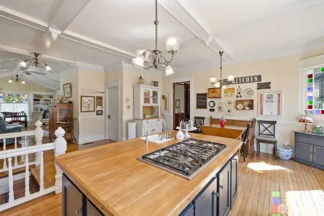 This nice open space allows everyone to stay connected. The closed, white door leads to a 3/4 bath and laundry.