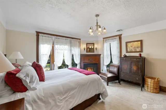Primary bedroom with gas fireplace and attached bath.