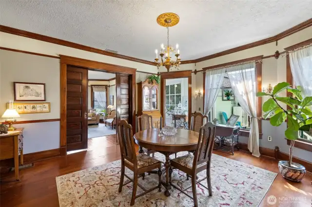 Formal dining room with entry to the sunroom.