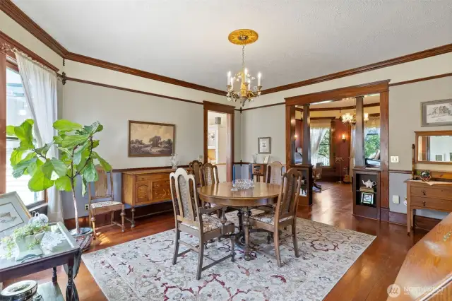 Formal dining with adjacent music room/office and entry to the kitchen from the door in the center of the picture.