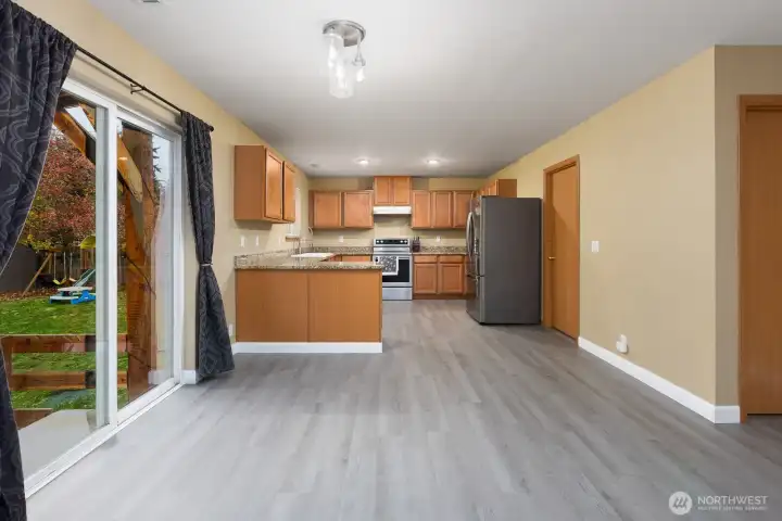 Gatherings and entertaining will happen is this spacious kitchen with beautiful granite countertops