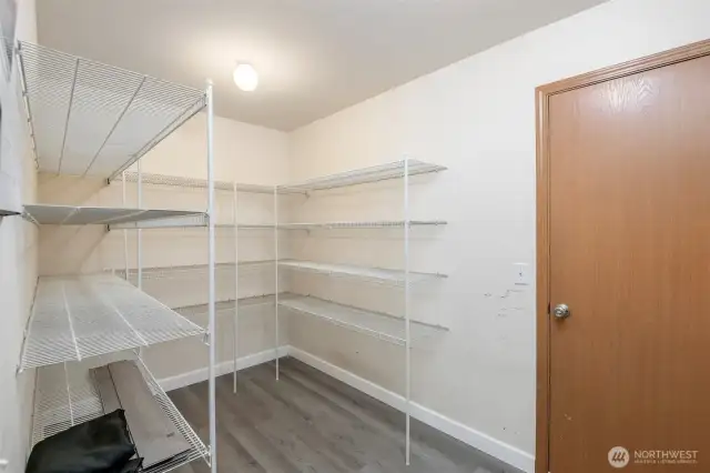 Plenty of storage in this huge walk in pantry