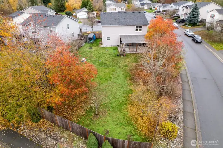 Large back yard with space for gardening and play