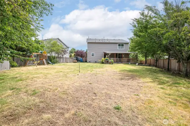 Huge back yard with playset and fully fenced