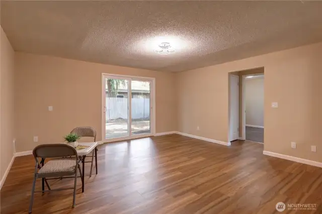 The living room is a nice size with sliders to outside.