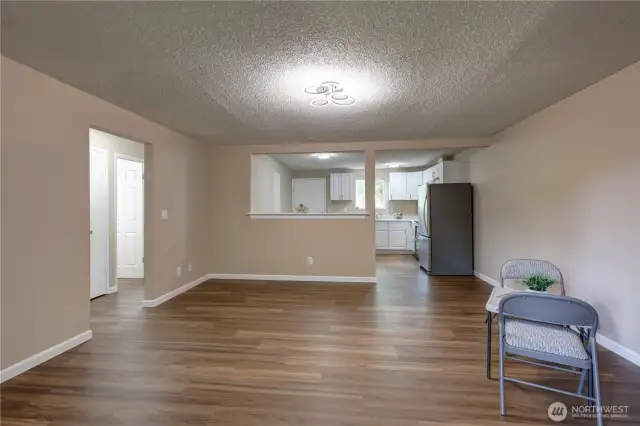 Livingroom looking towards the kitchen.  All new vinyl plank flooring