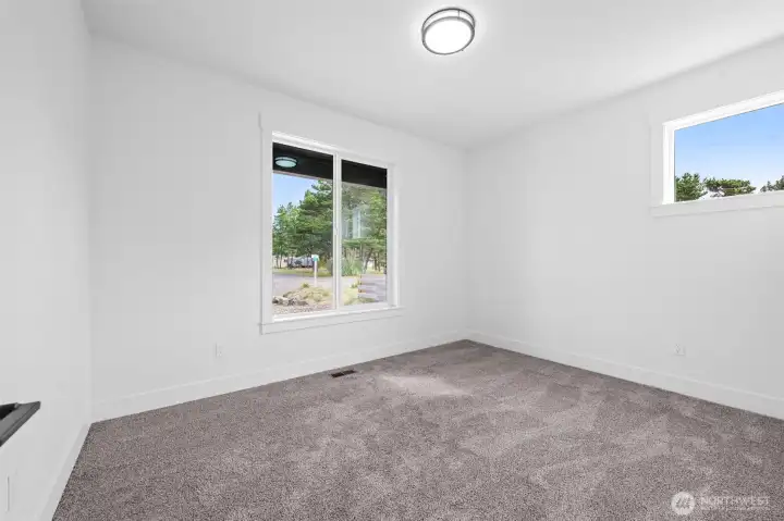 1 of 2 guest rooms separated from the living and primary bedroom