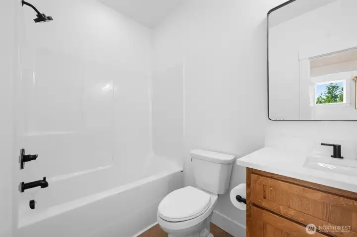 Second bathroom conveniently  located between both guest rooms.