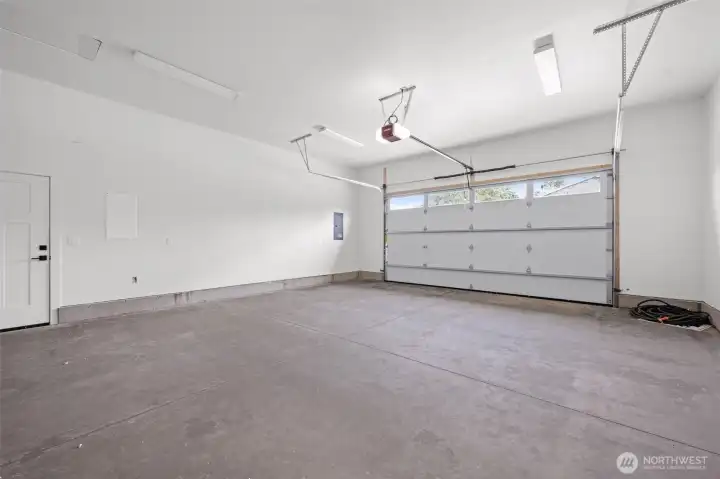 Oversized garage with plenty of room for storage plus a pull down attic door with more space which could be finished.
