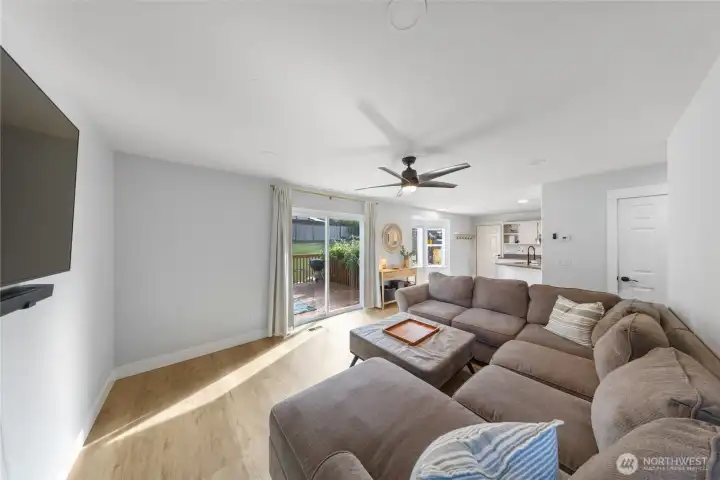 Sliding door leads to back deck, a great place to hang out in the sun.