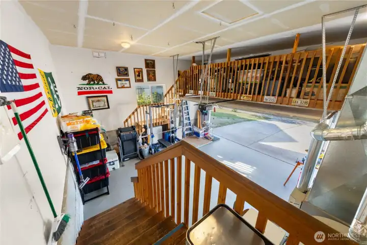 Garage has plenty of storage in loft area.