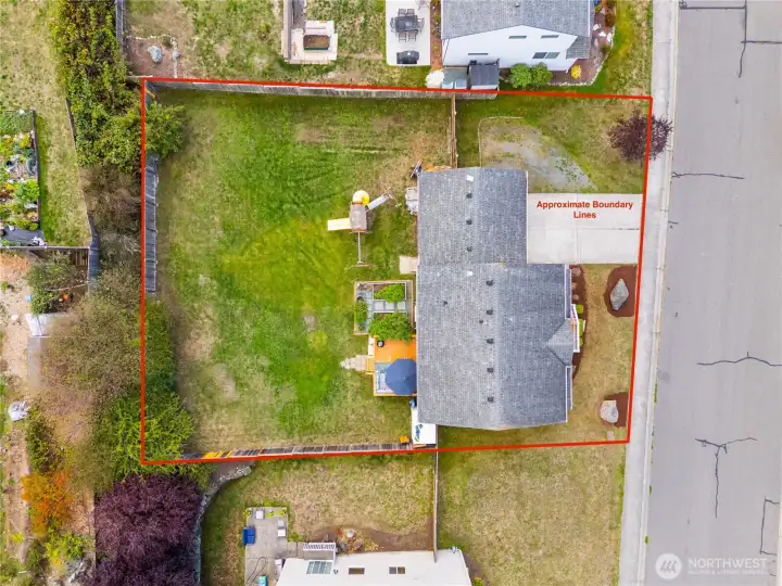 RV parking on the side of the driveway, double gate opens to the backyard for easy access.