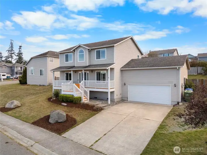 Large driveway makes room for extra parking and RV parking to the side.
