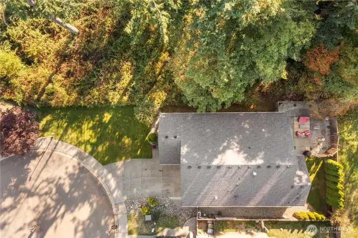 Nestled on a cul-de-sac in a small community of homes and privately situated on a beautiful green space