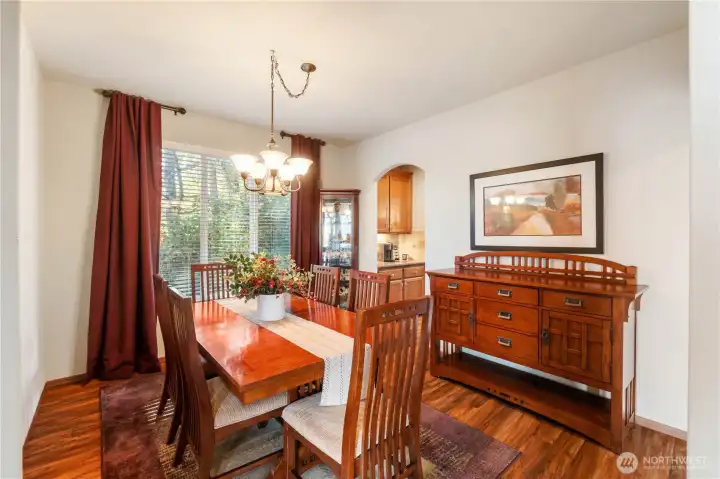 The dining room with view of the green space is perfect for holiday entertaining or could be used as a flex space