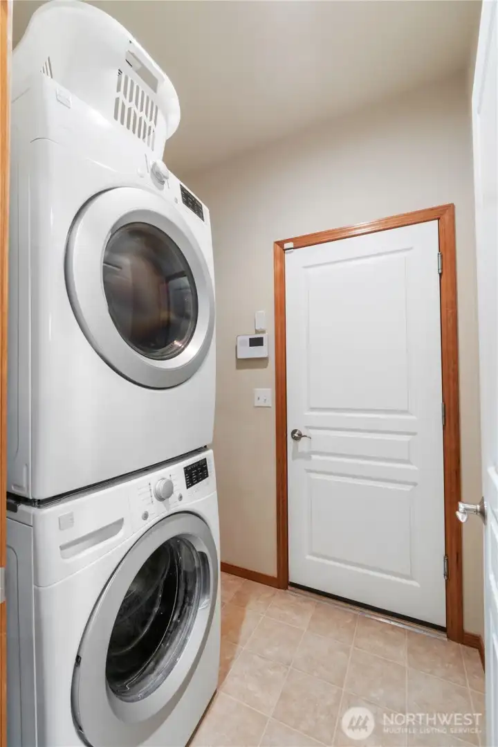 The laundry room sits off the hallway and leads to the garage. The home has a security system with interior sensors