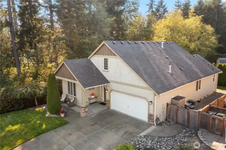 The roomy drive offers plenty of parking and the garage has added ceiling storage racks. The shed on the side of the home is also included