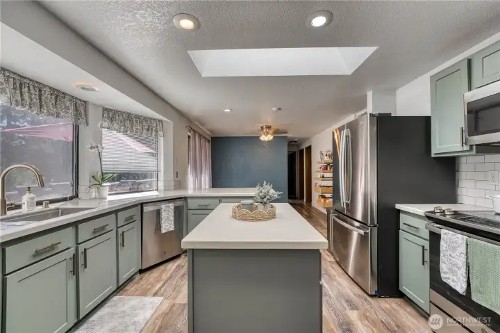 Recently remodeled kitchen with Corian countertops, soft close drawers and new appliances