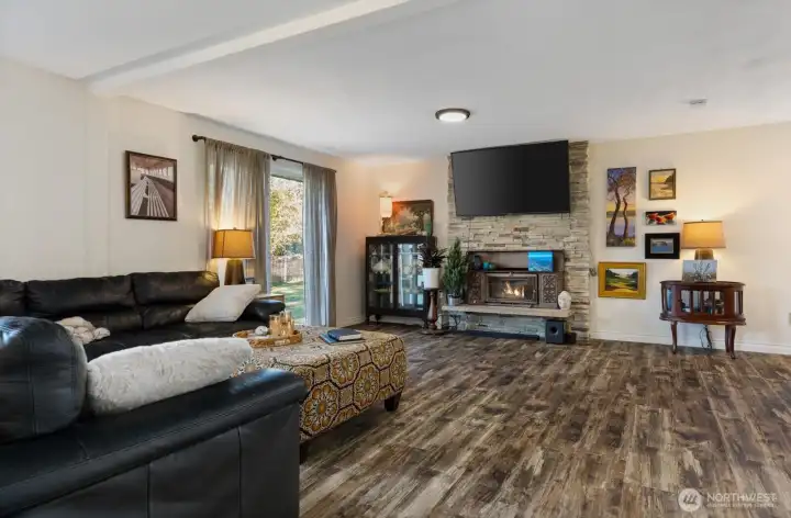 Living room with wood stove for cozy winters.