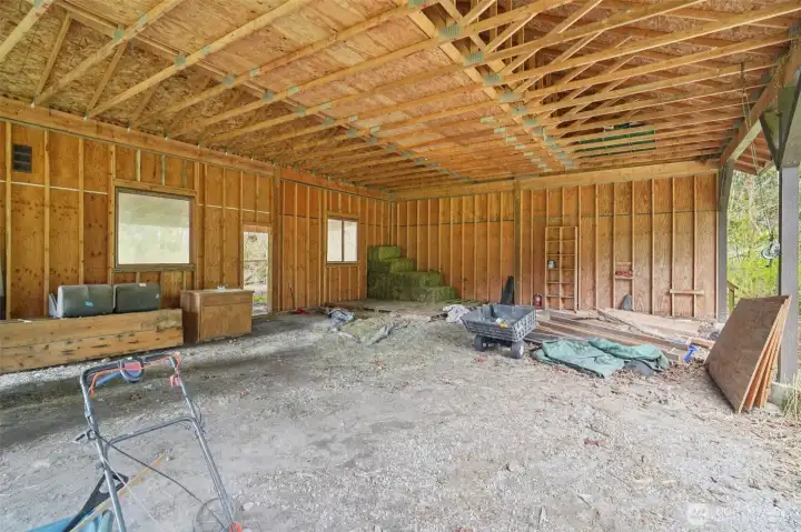 Spacious barn interior with room for equipment, hay storage, and flexible use