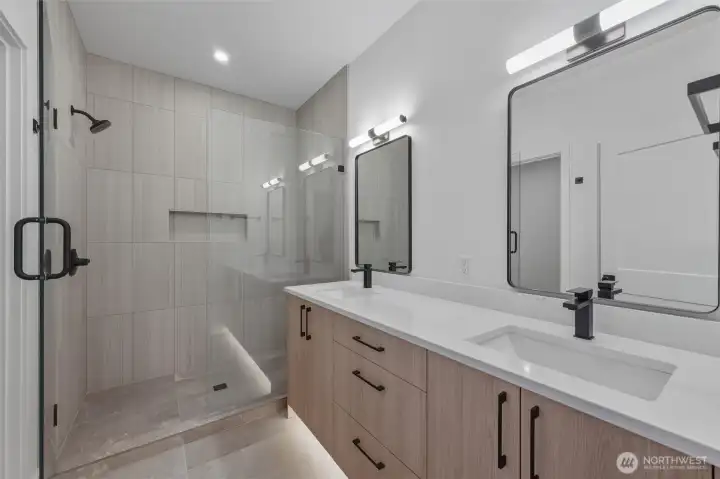 Gorgeous floor to ceiling tile work in the primary bath shower, along with under counter lighting Gorgeous floor to ceiling tile work in the primary bath shower, along with under counter lighting