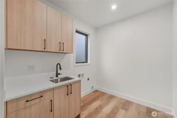 Large main floor laundry room. Large main floor laundry room.