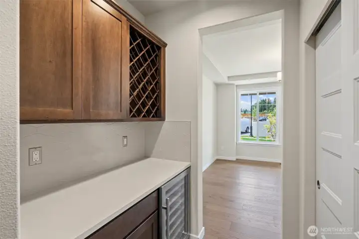 Butler’s pantry with a wine rack and under-counter cooler — a perfect entertaining feature.