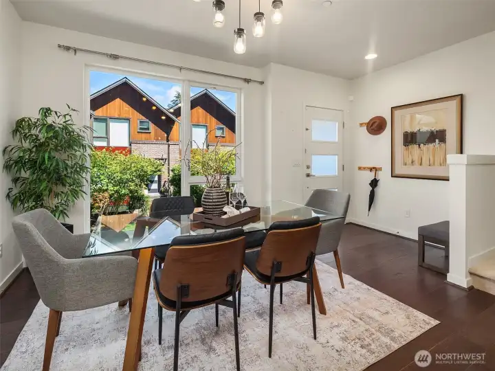 Dining area with large windows upon entry.