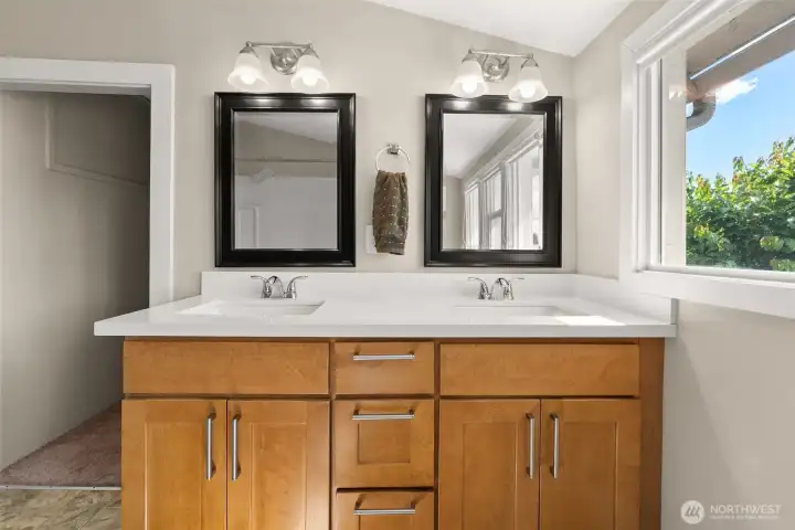 Walk in closet behind double vanity on second floor full bath