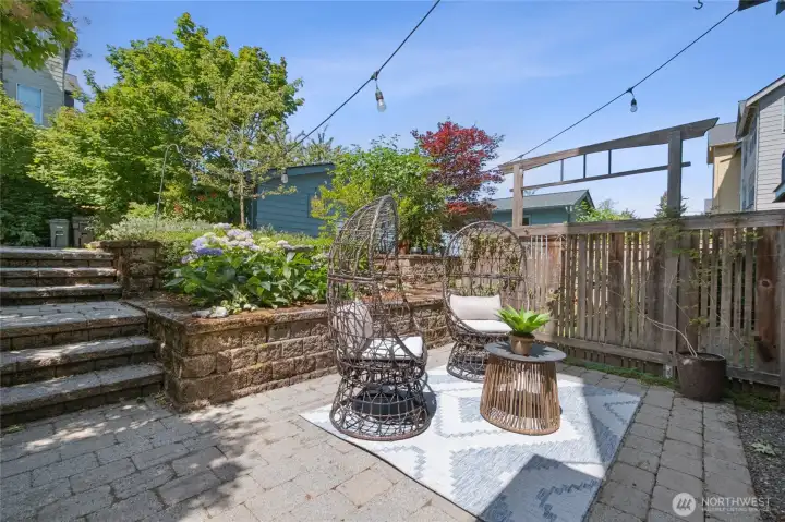 Large patio space that opens to alley, a natural gathering place.