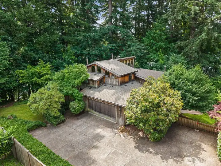 Exceptional property tucked in the trees just steps from Ward Lake