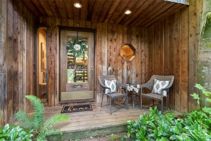 Enter through an original Montgomery Ward front door off covered porch