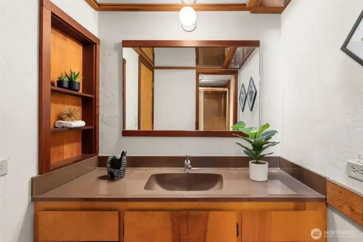 Upper bathroom with privacy door to toilet and shower