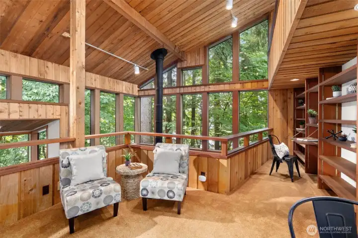 Views of the sitting area with built-ins and views