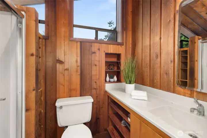 Primary bathroom with second sink area located around corner