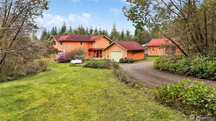 Main residence, guest house and garage from the main driveway