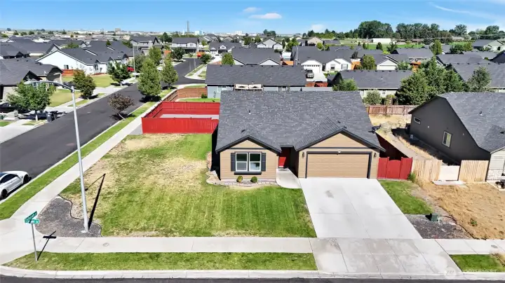 Attractive curb appeal with established landscaping.