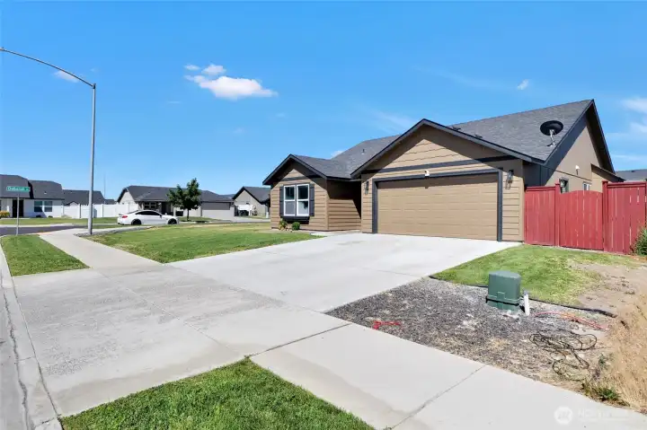 Attached 2-car garage with driveway parking.