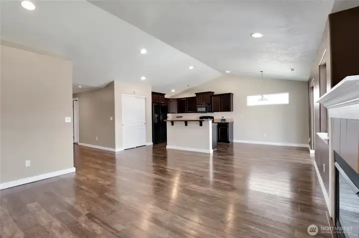 Durable luxury vinyl plank flooring throughout the main living spaces.
