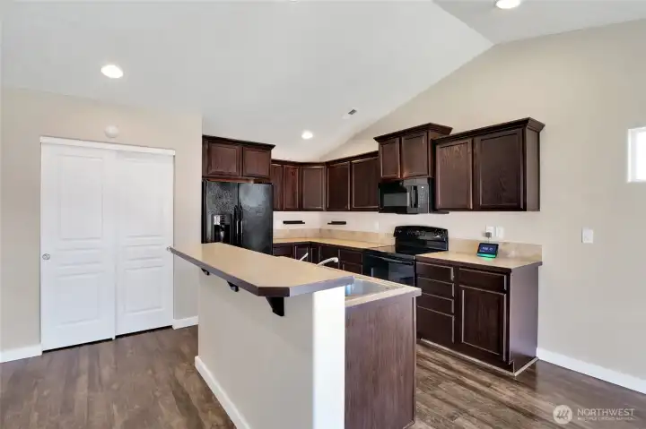 Black appliances complement the workspace.