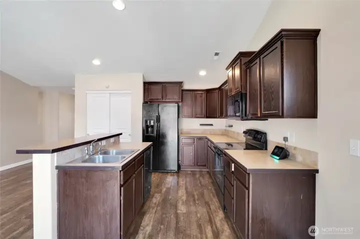 Laminate countertops provide generous prep space.
