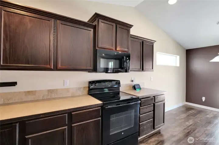 Functional kitchen with ample cabinet storage.