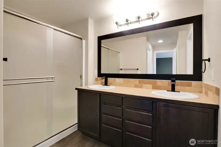 Private ¾ bathroom in the primary suite.