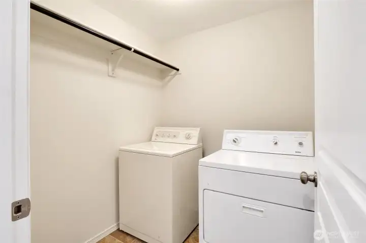 Dedicated laundry space adds everyday convenience.