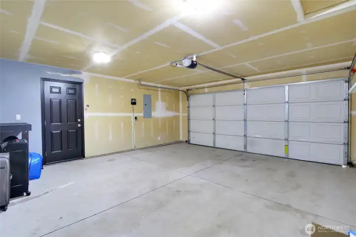 Attached 2-car garage with additional storage potential.