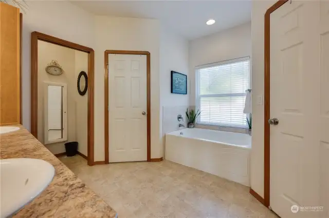 Primary bathroom with soaking tub and dual closets!