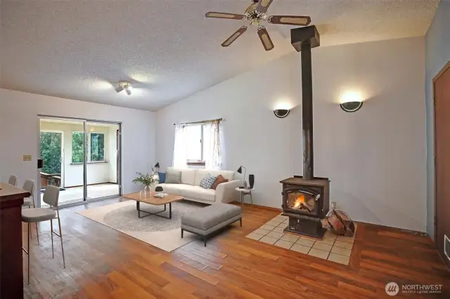Living room features a cozy wood burning fireplace